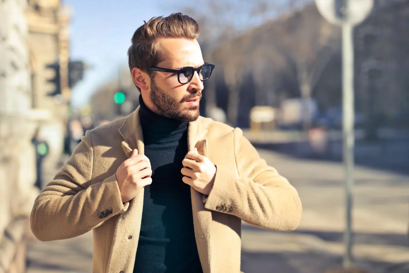 Man in a tailored coat on a city street